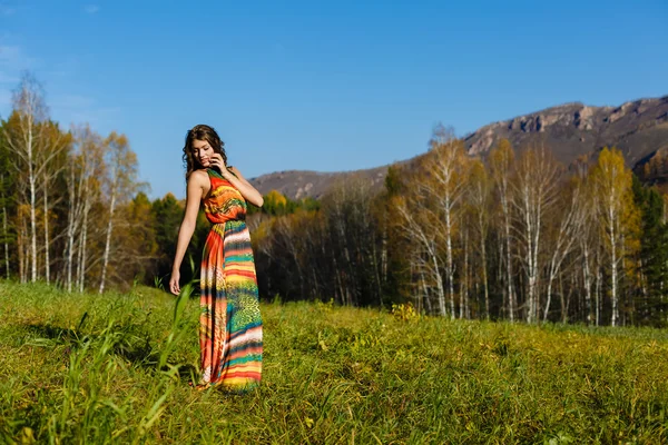 Happy young woman in the autumn wood of the mountain — Stock Photo, Image