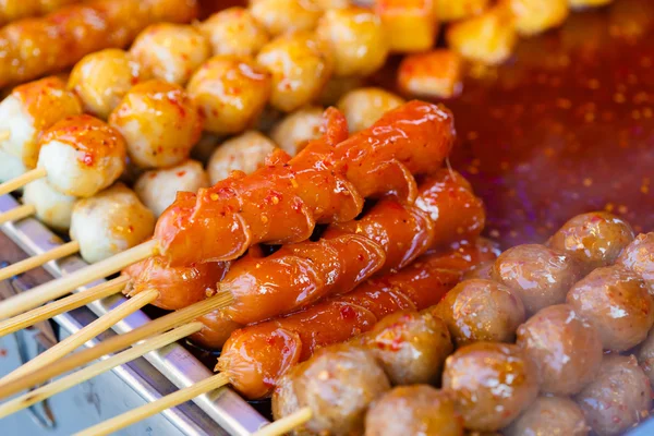 Fried meat balls a grill on a stick in sauce — Stock Photo, Image