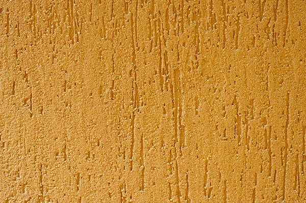 Rough yellow plaster closeup — Stock Photo, Image