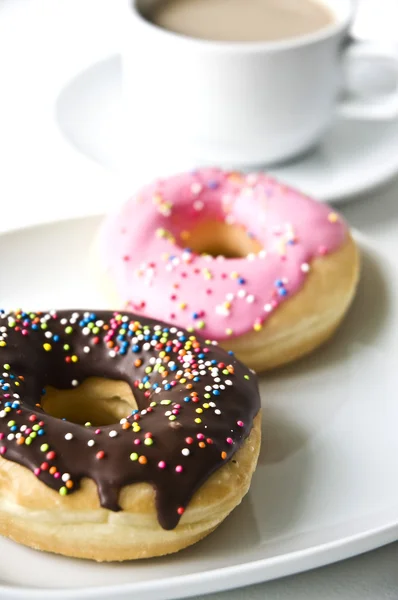 Donuts and coffee cup — Stock Photo, Image