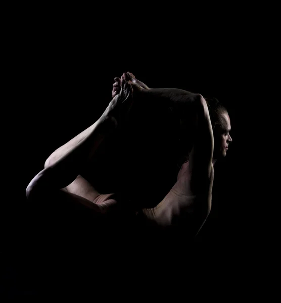 Young man practicing yoga — Stock Photo, Image