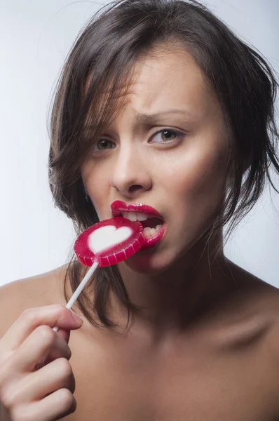 Portrait of a girl with a lollipop — Stock Photo, Image