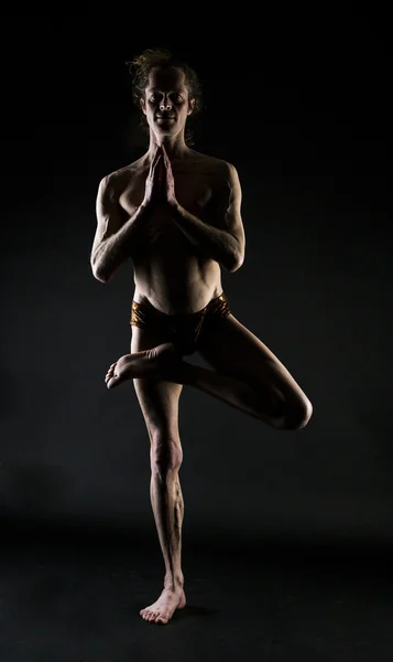 Young man practicing yoga — Stock Photo, Image