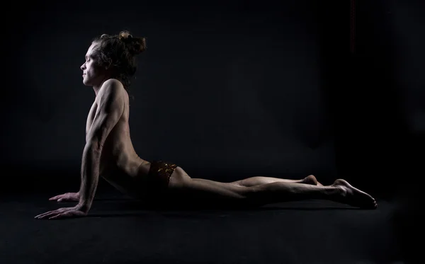 Young man practicing yoga — Stock Photo, Image