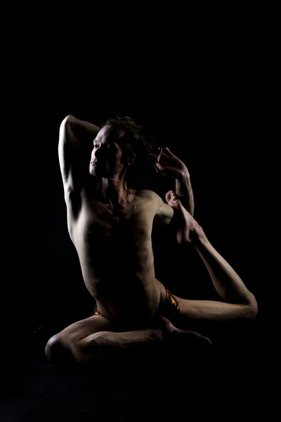 Young man practicing yoga — Stock Photo, Image