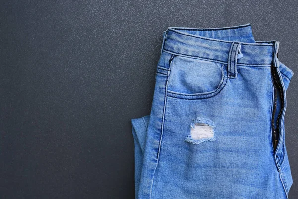 Jeans Azul Dobrar Fundo Azulejo Escuro Roupas Ganga Com Espaço — Fotografia de Stock