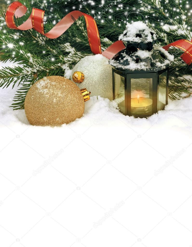 Christmas card with golden balls and a flashlight