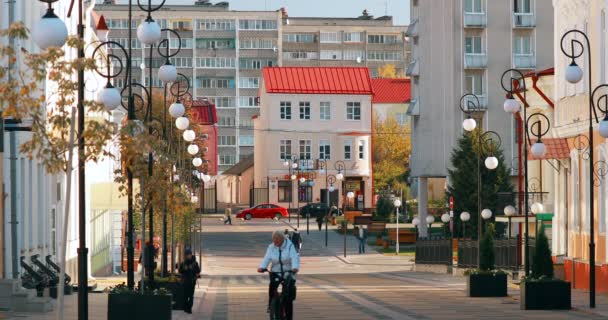 Pinsk, Brest Region, Belarus - October 14, 2019: People walking near old house in autumn day — Stock Video