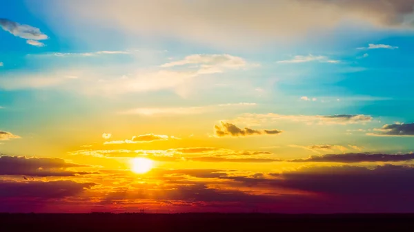 Bright Sun, Sunset, Sunrise. Colorful Blue and Yellow Sky.