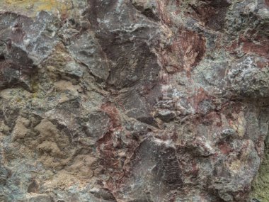 Geçmişi. Çok renkli taştan duvar.