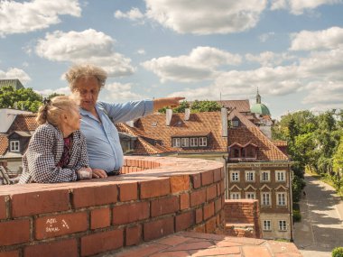 Portrait of elderly couple during the walk et barbacan in Warsaw clipart