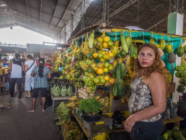 Leticia, Colombia - Dec 03, 2017: Tasty, fresh, colorful fruit and vegetable hanging on a market stall in a small town