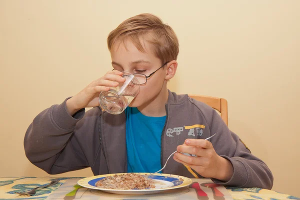 Boy is eating — Stock Photo, Image