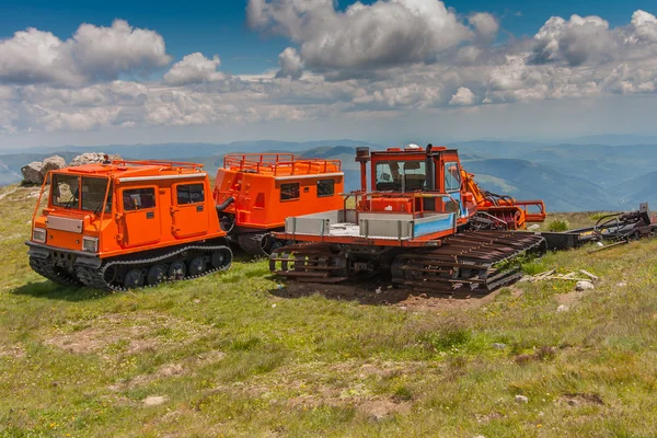 Renovated snowmobile waiting for the winter next to the ski lift — Stock Photo, Image