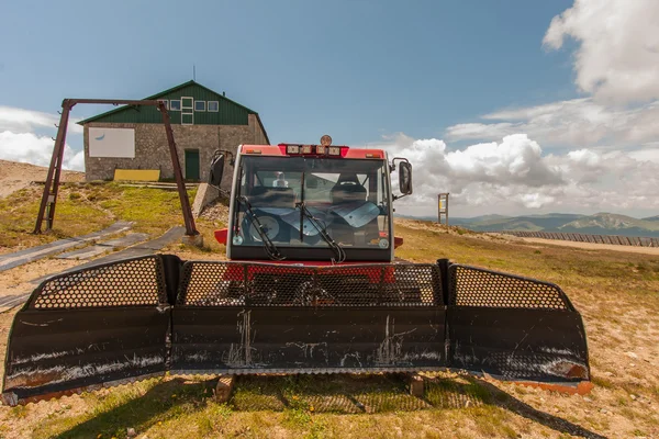 Renovated snowmobile waiting for the winter next to the ski lift — Stock Photo, Image