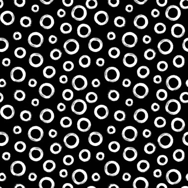 Fırça darbesi tekniğinde yüzüklerle siyah ve beyaz desenli. Rastgele boyanmış daireler ile vektör soyut arkaplan.