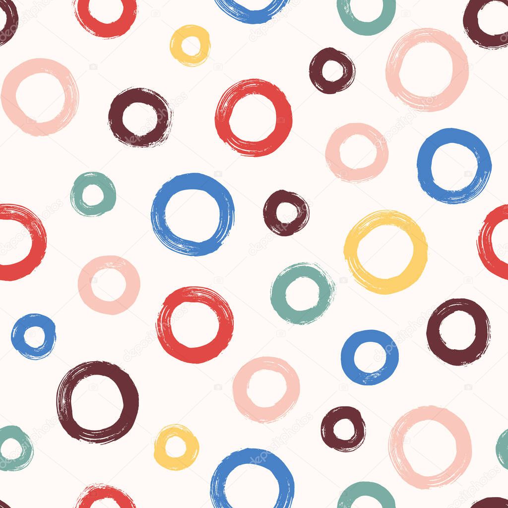 Colorful seamless pattern with rings in brush stroke technique. Vector abstract background with random hand painted circles.