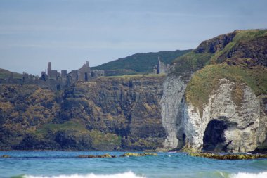 The beach is just off the Causeway Coastal Route and has a stunning natural coastal location with the white rock limestone cliffs stretching from Curran Beach to Dunluce Castle. clipart