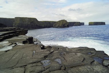 The Kilkee Cliff walk is a scenic 2 to 3 hour  moderate loop walk along the Kilkee Cliffs starting at the Diamond Rocks Caf, Pollock Holes car park. clipart