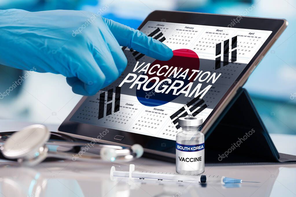Professional working in calendar of vaccines plan for South Korea nation, Immunization concept. Working with tablet in the program of the vaccination schedule for South Korea. Photomontage with 3d illustration