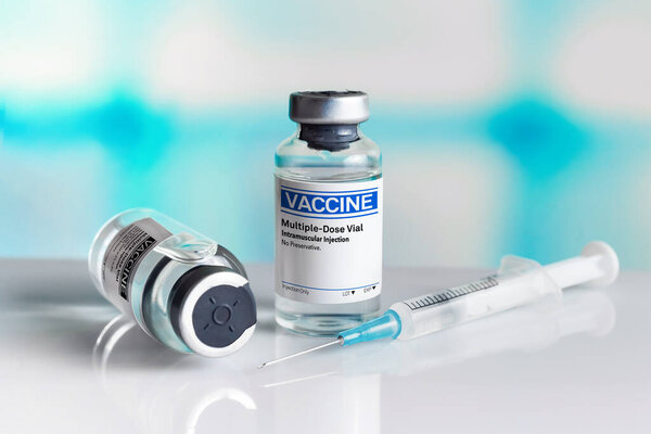 Vaccine equipment and syringe to administer vaccine doses to the population. generic injectable vaccines vials for the vaccination program against diseases and infections prevention