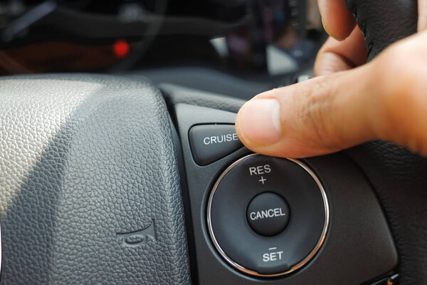 Cruise control buttons on modern car and speed limitation