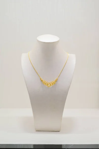 Gold jewelry diamond shop with  necklaces luxury retail store window display