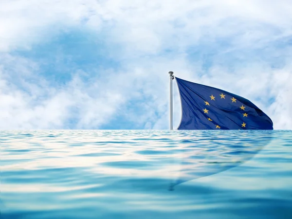 Europe flag in water with blue sky, as a symbol of crisis — Stock Photo, Image