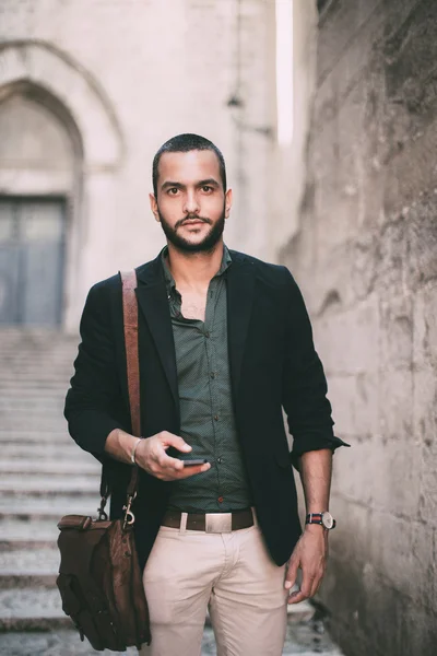 Portrait of young bearded man standing on the street — Stock Photo, Image