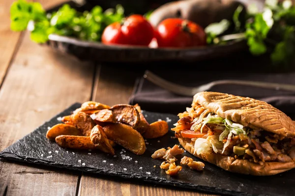 Doner kebab with fried potato on table — Stock Photo, Image