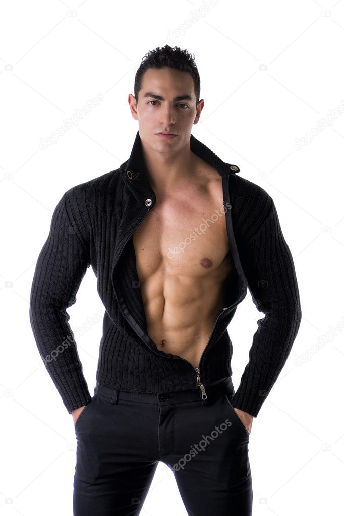Handsome muscular young man taking off shirt