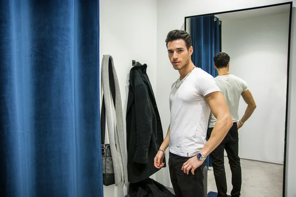 Young Man Trying on Clothes in Clothing Store — Stock Photo, Image