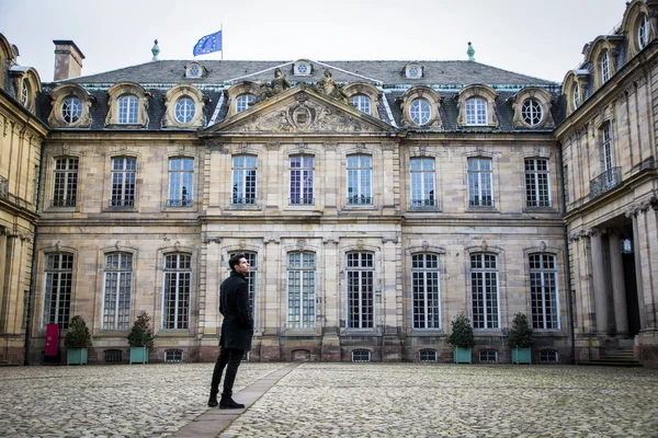 Young man at historic building in Strasbourg, France — Stock Photo, Image