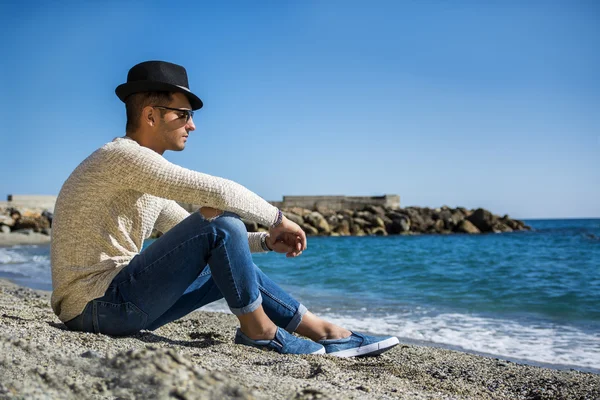 Young Man on a Beach in a Sunny Summer Day — Stock Photo, Image