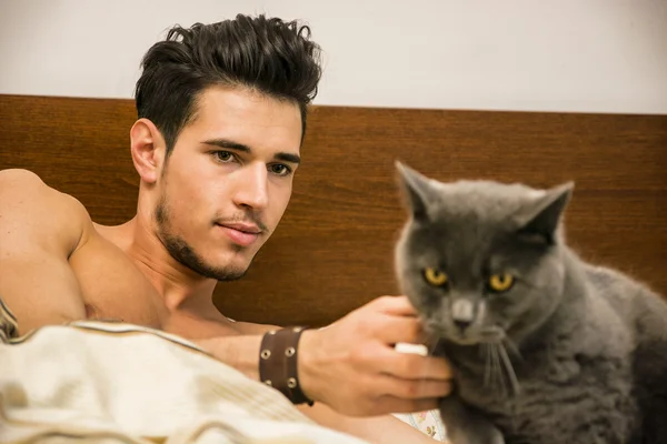 Handsome Young Man Cuddling his Gray Cat Pet — Stock Photo, Image