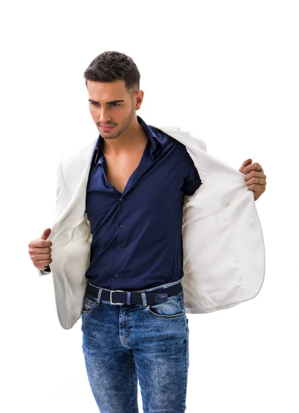 Young smiling man in blue shirt and white jacket — Stock Photo, Image