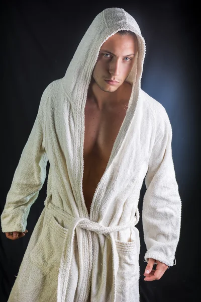 Handsome young man wearing white bathrobe — Stock Photo, Image