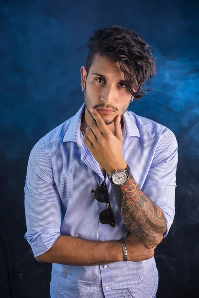 Stylish handsome young man in studio shot — Stock Photo, Image