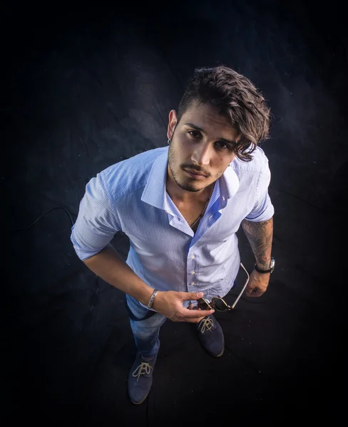 Stylish handsome young man in studio shot — Stock Photo, Image