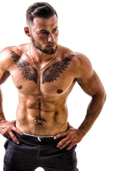 Hombre musculoso guapo en topless de pie, aislado —  Fotos de Stock