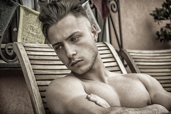 Young Man Sunbathing on Lounge Chair — Stock Photo, Image