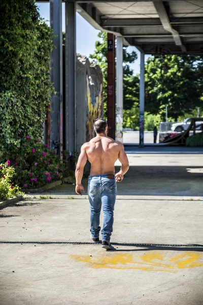 Handsome Muscular Shirtless Hunk Man Outdoor in City Setting