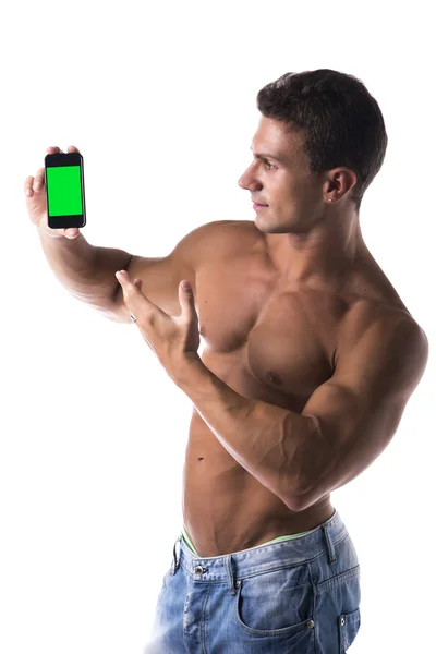 Handsome man pointing to his mobile — Stock Photo, Image