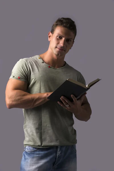Handsome Sexy Muscular Man Reading Book — Stock Photo, Image