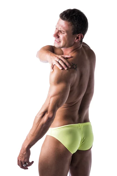 Muskulös, gut aussehender Mann hält seine Schulter Schmerzen — Stockfoto