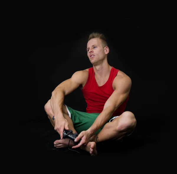 Disappointed Young Man on Floor Holding Joystick — Stock Photo, Image