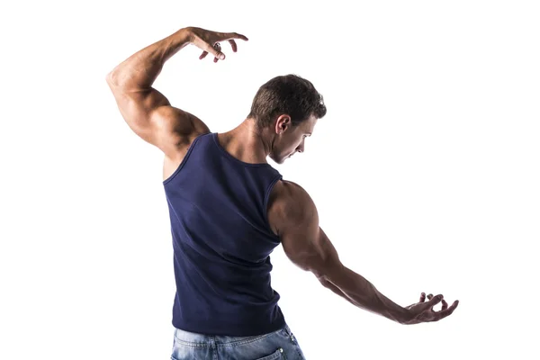 Back of attractive bodybuilder in t-shirt and jeans — Stock Photo, Image