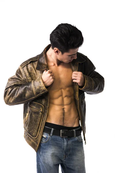 Handsome young man wearing leather jacket on naked torso — Stock Photo, Image