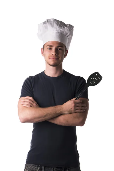 Νεαρός αρχιμάγειρας αρσενικό μαύρο πουκάμισο και λευκό καπέλο — Φωτογραφία Αρχείου