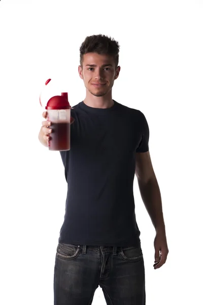 Attractive young man or teenager holding protein shaker — Stock Photo, Image